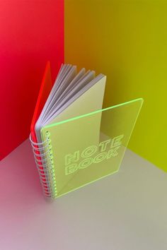 neon acrylic notebook photography product fuchsia Acrylic Notebook, Acrylic Laser Cut, Clear Notebook, Notebook Photography Product, Neon Stationery, Notebooks Photography, Corporate Notebook Design Branding, Stationery Box Set, Colorful Notebooks