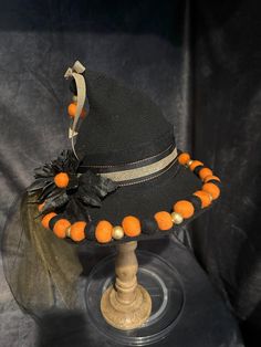 Unique, handmade, witch hat! Featuring a whimsical Halloween design with a cottage core/country feel with felt, cloth accents and florals, this eye-catching hat is sure to add that special touch to your costume, witchy vibe, and everyday flair!  Attention to all the little details makes this hat special. Comfortable to wear and a definite eye-catching design!  Hat is made of a slight stretchy knit blend that is soft, breathable and lightweight. One size fits most. Brim is wired so it can easily be shaped to your desire. Head 57cm = 22.44" Brim 5cm = 1.97" (may be small differences) All of my hats are unique and one of a kind. I really enjoy making them and creating a wearable piece of art! Adjustable Brimmed Felt Hat For Halloween, Halloween Costume Felt Hat With Brim, Brimmed Felt Hat For Halloween Costume, Black Felt Hat For Halloween Costume, Halloween Costume Felt Hat, Whimsical Black Halloween Hat, Whimsical Black Hats For Themed Events, Whimsical Black Hat For Themed Events, Curved Brim Felt Hat For Halloween Costume