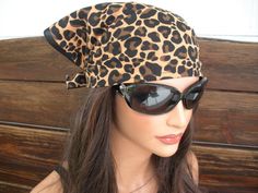 "NEW - Summer Fashion Headscarf Bandana Headband. Leopard print bandana headscarf - Women's headscarf - Summer fashion headband. Material: Leopard print bandana - 100 % Cotton Women / Teen size One size Size: Approximate - 60 \" inches long including straps Approximate - 15 \" inches height Care instructions: Hand wash cold. Lay flat to dry. Air dry only." One Size Bandana With Bandana Print For Beach, Brown Bandana Print Bandana For Festivals, Brown Bandana With Bandana Print For Festival, Festival Brown Bandana With Bandana Print, Casual Brown Adjustable Bandana, Trendy One Size Bandana Print Headscarf, Trendy Bandana Print Headscarf One Size, Trendy Bandana Print Headband, Trendy Beach Bandana With Matching Headband