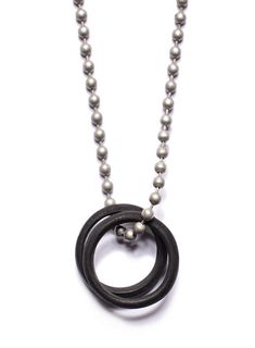 The Black Glass Two Rings Necklace for men is made from African black glass rings. Symbolic of eternity, commitment, and the love experienced between two people, these rings will fill you with a sense of time and emotion. Because of the vintage origin of the rings, now two rings/necklaces are alike and will vary slightly from the photo. Length of brass chain: 28 inches Military Necklace, Military Jewelry, Two Rings, Anchor Necklace, Rings Necklace, Ball Chain Necklace, Jewelry For Men, Necklace For Men, Geometric Pendant