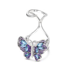 Our gorgeous flying butterfly ring, with its distinctive workmanship, pays tribute to the glamour and elegance of this creature. Through its graceful movement between your fingers, it recreates the fluttering charm of wings and adds unique enchantment to your femininity. Combing beautiful colors and asymmetry, this dazzling piece highlights eight brilliant marquise-cut blue stones, and smaller round stones in purple paved on wings. The multi-colored butterfly, fashioned in fine sterling silver, Flying Butterfly, Blue Stones, Butterfly Ring, Amethyst Purple, Precious Metal, Works Of Art, Stone Settings, Blue Stone, Cocktail Rings