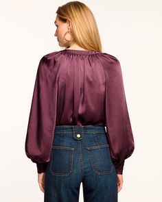 Take an extra 25% off with code BYE2024 A long puff sleeve blouse designed for work or play, wear the Nevada on repeat all season. The Nevada offers a relaxed silhouette, paired with an elastic waistband perfect for tucking into denim, and leverages a v-neckline with contrast stitching detail. Size & Fit – This style runs small, we suggest sizing up. – Model is Wearing Size XS – Model is 5'9" Size Guide Details & Care – Mini length – Collared v-neckline with buttons – Bra friendly – Long sleeve Chic Long Sleeve Tops With Elastic Cuffs, Versatile Long Sleeve Top For Workwear In Fall, Long Sleeve Tops With Elastic Cuffs For Work, Chic Tops With Elastic Waistband For Work, Long Sleeve Tops With Elastic Waistband And Relaxed Fit, Chic Workwear Top With Elastic Waistband, Fall Workwear Tops With Smocked Cuffs, Relaxed Fit Long Sleeve Puff Sleeve Top For Work, Relaxed Fit Tops With Elastic Waistband For Fall