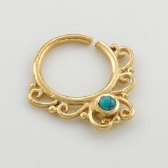 Unique and beautiful septum ring for pierced nose. Tribal, ethnic, delicate design. Can be worn as an earring for the tragus or earlobes as well. Material: Brass, Turquoise. *Also available in gold plated brass and Sterling silver ( Use scroll bar to choose your material) Inner diameter: 0.35 Inch - 8.5 mm Thickness: 1 mm - 18 gauge Measures: W- 0.59 Inch - 15 mm / L - 0.7 Inch - (18 mm) *Nickel- free Taking care of your septum ring: > How to use a septum ring- In order of taking care of your Tragus Gold, Tragus Earrings Hoop, Gold Septum, Pierced Nose, Tragus Hoop, Septum Piercings, Tragus Jewelry, Piercing Septum, Tragus Earring