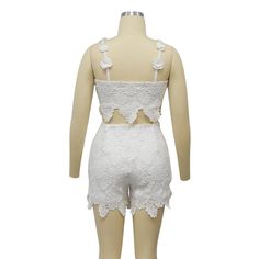 Indulge in luxury with our Feminine Lace Applique' Shorts Set. Featuring delicate lace appliques, this set exudes elegance and sophistication. Perfect for a romantic evening or a special occasion, this set will make you feel confident and stylish. Elevate your wardrobe with this exclusive piece. Sizes S-2XL Decoration Zip Up , Lace Length Above Knee, Mini Style Sexy & Club Fabric Type Blended fabrics , Lace Material Polyester , Spandex Neckline Strappy Pattern Type Solid Sleeve Length Sleeveless Season Summer Fabric Non-Stretch Elegant Lace Set For Wedding Night, Spring Wedding Lace Sets, White Lace Feminine Sets, Feminine Two-piece Party Sets, Elegant Lace Sets For Night Out, Elegant Lace Work Sets For Summer, Spring Party Sets With Lace Work, Elegant Summer Wedding Night Set, Feminine Fitted Sets With Lace Trim