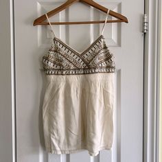 Hollister White Beaded Tank Top Size: Small Never Worn 55% Cotton, 45% Viscose Embellished Cream Top For Summer, Summer Beige Beaded Tops, Summer Beaded Beige Tops, Summer White Beaded Top, Beaded Beige Tops For Summer, Summer V-neck Beaded Top, Summer Beaded V-neck Tops, White Beaded Top For Summer, Beaded V-neck Tops For Summer