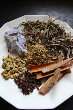 a white plate topped with different types of spices