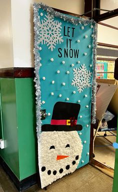 a bulletin board with a snowman on it