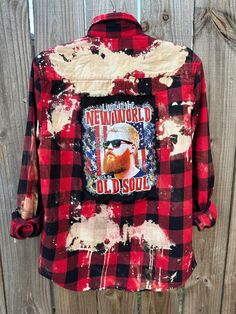 This is a one of a kind Oliver Anthony plaid flannel shirt.  This size SMALL plaid shirt has two pockets on the front, buttons up and is long sleeve. On the back of the shirt is a Oliver Anthony tee that has been sewn into the back of the shirt. The flannel has been bleach and is frayed around the tee giving it an overall distressed vintage style look.  All my shirts are ONE OF A KIND. They are all upcycled by being previously owned so there will be signs of wear and tear. This is what make each shirt unique in its own way and for sure makes them the most comfortable.  *NOTE: ALL of our shirts are MENS sizes unless otherwise stated above.  Upcycled/Bleached/Distressed Long Sleeve Size Small 100% Cotton Button Up Here are some ways to style your flannels.  1) wear cowboy boots or tennis Flannel Shirt With Pockets For Streetwear, Fall Pre-washed Button-up Shirt, Distressed Button-up Shirt For Fall, Button-up Flannel Shirt For Streetwear, Flannel Button-up Shirt For Streetwear, Streetwear Flannel Button-up Shirt, Americana Style Cotton Tops For Fall, Casual Distressed Shirt For Fall, Distressed Long Sleeve Shirt For Fall