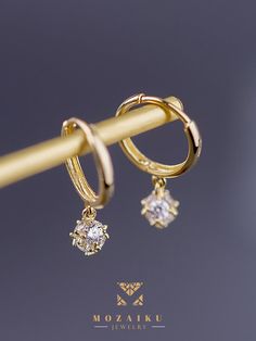 Diamond pavé creates a perfect droplet for these buckle earrings, which are the signature collection of Mozaiku. Now you can choose in either 14K or 9K gold Specification: Precious Metal Condition : 9K Gold / 14K Gold Purity : 14k yellow gold, 9K yellow gold Stone : Zircon Custom made Gold Drop Hoop Earrings Fine Jewelry, Gold Huggie Earrings With Diamond Accents In 14k Gold, Gold Dainty Earrings With Diamond Accents, Gold Huggie Earrings With Prong Setting, Yellow Gold Dangle Earrings With Prong Setting, Gold Drop Earrings With Prong Setting, Dainty Gold Earrings With Diamond Accents, Gold Tarnish Resistant Round Cut Earrings, Gold Tarnish-resistant Round-cut Earrings