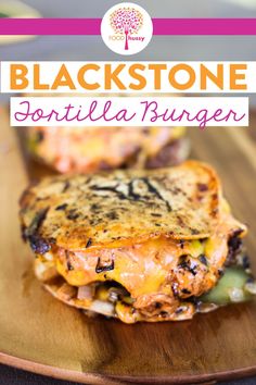 black stone grilled sandwich on a wooden plate with text overlay that reads,'black stone tortilla burgers '