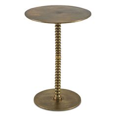 a small round table with an iron base and bead design on the top, against a white background