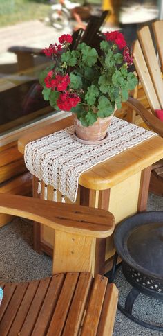 a potted plant sitting on top of a wooden chair