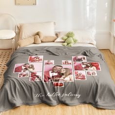 there is a bed with pictures on it and a teddy bear next to the bed