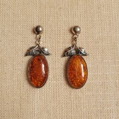 Beautiful Dangle, Drop Earrings Made Of Sterling Silver And Amber. For Pierced Ears. The Oval Amber Cabochons Have Intricate, Art Nouveau-Style Leaf Designs On Top. The Amber Is A Rich Shade Of Orange And Full Of Inclusions. Marked 925 For Sterling On The Rings Attached To The Amber Charms. The Earring Balls And Posts Seem To Be Newer And May Not Be Original. Good Vintage Condition With Normal Wear And Patina For Age. Knitting Moodboard, Intricate Art, Leaf Designs, Bridal Bands, Shades Of Orange, The Rings, Pierced Ears, Owl House, Leaf Design