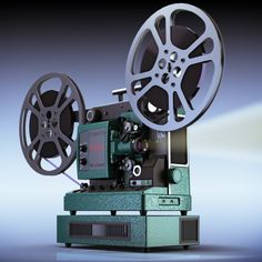 an old movie projector sitting on top of a green box with the film reel attached to it