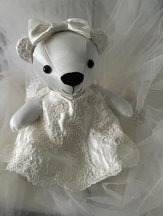 A wedding Keepsake Bear can be made from your wedding dress as a symbol of the love and joy of your special day. The gown is carefully deconstructed and repurposed into a one-of-a-kind treasure. As you hold the bear in your hands, you'll feel the softness of the fabric and the weight of the emotions woven into the stitches. Its enduring design, complete with lace, pearls, and intricate beadings, encapsulates the beauty and elegance of your wedding dress. Whether you gift this cherished keepsake to a loved one or keep it for yourself, the Keepsake Bear is a constant reminder of the extraordinary bond shared with a significant other. Whenever you need a comforting presence or a gentle reminder of the love surrounding you, simply reach out, hold your Keepsake Bear close, and feel the warmth a Memory Wedding, Keepsake Wedding, Keepsake Bear, Wedding Keepsakes, Wedding Memorial, Bear Toy, Bear Pattern, Stuffed Toy, Significant Other