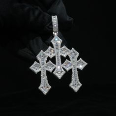 Details: Material: White Gold plating over .925 Sterling Silver base with Moissanite Stone: VVS Moissanite Pendant height: Tripe cross 2.08"(H) Bail size: Fit through chain maxi. 10mm(W) Pendant weight: Single cross: 15.7g, Triple cross: 41.6g Moissanite Pendant, Holiday Sales, Gold Plating, Cross Pendant, Plating, White Gold, 925 Sterling Silver, Sterling Silver, Chain