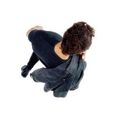 a woman flying through the air while riding a skateboard in front of a white background