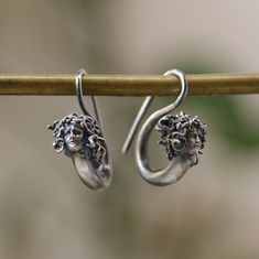 Medusa Earring 925 Silver, Witch Medusa Jewelry, Snake Jewelry,, Handmade Earring, Mythological Jewelry, Greek God, Earring Antique Silver This is made with 925 Silver material. Let's not forget that it is handmade. There may be minor differences. It can be made with other materials. You can send a message. If you have any questions, please feel free to contact me, we are happy to help. Your jewelry will be packed in a luxury jewelry box ready to be given as a special gift. Visit my shop to view Symbolic Silver Earrings With Ear Wire, Symbolic Sterling Silver Drop Earrings, Symbolic Sterling Silver Pierced Earrings, Unique Sterling Silver Hoop Earrings For Pierced Ears, Unique Sterling Silver Pierced Earrings, Unique White Gold Pierced Earrings, Symbolic Silver Sterling Silver Plug Earrings, Silver Symbolic Earrings For Jewelry Making, Handmade Sterling Silver Round Plug Earrings