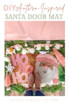 someone standing in front of a door mat with the words santa's door mat on it