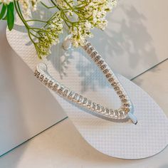 Rhinestones Bridal Flip Flops, custom crystal bridal sandals, Rhinestone shoes for beach destination wedding - custom color your choice Cute wedding flip flops, made with flat white flip flops, silver stone chain and silk thread for extra softness. The thread can change according to the colors of your wedding, let me know how you want them and I will design them for you on that special day Also available with golden rhinestones Beautiful sandals for beach / summer weddings and for a bridal party Silver Bling Wedding Sandals, Adjustable Bling Sandals For Beach, Adjustable Bling Beach Sandals, Summer Sandals With Rhinestones As Gift, Summer Rhinestone Sandals As Gift, Silver Bedazzled Sandals For The Beach, White Sandals With Rhinestones And Adjustable Fit, Bedazzled Silver Sandals For The Beach, White Rhinestone Sandals For Vacation