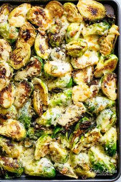 brussel sprouts and chicken in a casserole dish with melted cheese