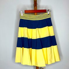 Adorable Navy And Yellow Z Spoke Striped Skirt. Never Worn With Tags. Zipper Detail On The Back And Super Cute Belt Stripe Detail Yellow Stretch Pleated Skirt, Yellow Pleated Stretch Skirt, Yellow Fitted Tiered Skirt, Fitted Yellow Tiered Skirt, Fitted Yellow Tiered Mini Skirt, Yellow Full Flowy Skirt, Yellow Flowy Full Skirt, Yellow Color Block Bottoms For Spring, Yellow Stretch Flared Skirt