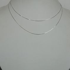 A Sterling silver box neck link chain. Length: 16 inches. Weight: 1.6gm Length: 18 inches. Weight: 1.87gm This necklace is made of 925 hypoallergenic sterling silver. Most of my pieces come with a 925 stamp. Please go through all the pictures posted for this item to gauge the actual size. Can be packaged in a gift box. I can include a personal message from you if needed You are welcome to contact me at... bhavnakwintra1956@gmail.com For more beautiful pieces from my shop, please browse 👇 TOE RI Simple Silver Clavicle Chain Necklace, White Minimalist Snake Chain Jewelry, Minimalist White Snake Chain Jewelry, Simple Silver Chain Necklace As Gift, Simple Silver Chain Necklace Gift, White Sterling Silver Snake Chain Necklace, Simple Silver Delicate Chain Necklace, Simple Silver Chain Jewelry, Delicate Silver Cable Chain Necklace