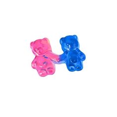 two gummy bears sitting next to each other on a white surface with blue and pink colors