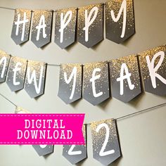 a happy new year banner hanging on a wall with the words digital download below it