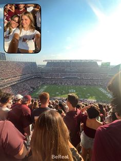 two women and one man are taking pictures at a football game