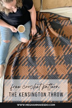 a woman sitting on top of a bed holding a cup of coffee