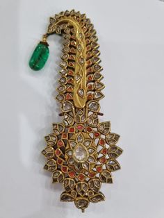 Stunning Vintage Brooch Pendant , 22k diamond traditional Kalgi Pendant , Vintage green onyx Diamond kalgi pendant, 22k diamond brooch, Can also be worn as a pendant 22k gold 65 gms More than 25 years old gross wt 110 gms polki diamond 7-8.50 carats Natural green Onyx Drop 5-25-2022S7700 Gold Meenakari Temple Necklace For Designer Wear, Traditional Kundan Hand-set Tikka, Traditional Kundan Tikka Hand Set, Traditional Green Jewelry With Stone Work, Traditional Jewelry With Stone Work For Diwali, Traditional Yellow Gold Tikka For Festivals, Traditional Kundan Temple Necklace For Designer Wear, Traditional Green Stone Work Jewelry, Traditional Stone Work Jewelry For Diwali