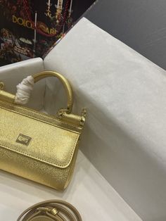 Description D.G Small Sicily Bag In Dauphine Gold For Women 7.5in/19cm DG Rep 1:1 Size: 19 x 13 x 6 cm / 7.5 x 5.1 x 2.3 inches (Length x Width x Height) Front flap with hidden magnetic fastening Branded plate featuring two metal plating finishes Top handle and adjustable, detachable strap in Dauphine Printed fabric lining and flat pocket Item comes with a branded dust bag Includes box, dust bag. This product is of the best quality. Sicily Bag, Gold For Women, Louis Vuitton Shirt, Gucci Gg Marmont, Stylish Handbags, Fall Earrings, Evening Clutch Bag, Girls Bags, Accessories Store