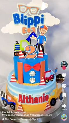 a birthday cake with an image of a man on top and the words blippi e