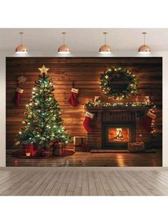 two christmas trees in front of a fireplace with stockings on the mantle