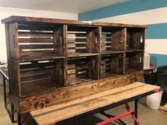 an old wooden cabinet is being constructed into a workbench with drawers on top