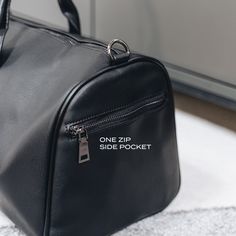 Designed to be minimal and understated, we've made a bag perfect for everyday use. It has an outer zip pocket, a grab handle, three inside pockets, and a leather shoulder strap. 52cm x 22cm (can be used as carry-on luggage) Includes shoulder strap Outer zip pocket perfect for accessories Two open inside pockets and one inside zipped pocket Made from vegan leather. Be Minimalist, Leather Weekender, Coach Horse And Carriage Tote, Carry On Luggage, Duffel Bag, Louis Vuitton Damier, Bag Making, Inside Pocket, Carry On