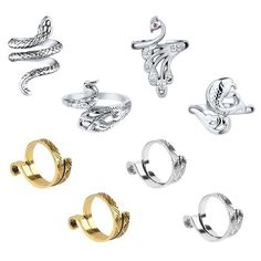 six rings with different designs and sizes on each one, including an elephant, bird, snake