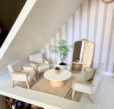 a living room filled with furniture and a mirror