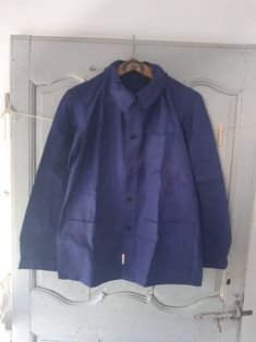 "Vintage French workwear cotton jacket. Deadstock condition Measures Chest 42\" 107cm Shoulders 17\" 43cm Neck to hem 30\" 76cm Shoulder to cuff 25\" 64cm 652g" Collared Cotton Sport Coat With Pockets, Utility Style Long Sleeve Cotton Sport Coat, Utility Style Cotton Sport Coat With Long Sleeves, Utility Cotton Sport Coat With Long Sleeves, Cotton Collared Sport Coat With Pockets, Cotton Long Sleeve Utility Sport Coat, Relaxed Fit Cotton Blazer With Long Sleeves, Winter Cotton Sport Coat For Workwear, Unstructured Long Sleeve Cotton Blazer