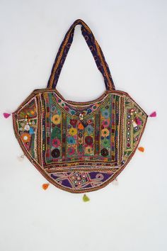 This gorgeous Indian Jaipuri Morral is perfect to style with any outfit! It is completely hand-embroidered and made on a waist loom, These beautiful bags are handmade by Indian artisans in Jaipur, Rajasthan. Material - 100% Cotton Fabric, The bag closes with a High-Quality zipper. Our bags are strictly produced by our skilled team with the natural traditional way of craftsmanship. A Perfect Shoulder Bag / Hobo Bag / Tote Bag / Hand Bag to give to an elegant look. This is the perfect gift for all Traditional Handmade Multicolor Embroidered Hobo Bag, Traditional Handmade Multicolor Embroidery Hobo Bag, Embroidered Multicolor Hobo Tote Bag, Festival Embroidered Multicolor Hobo Bag, Multicolor Handwork Rectangular Potli Bag, Handmade Multicolor Embroidered Hobo Bag For Festivals, Traditional Handmade Multicolor Hobo Bag, Traditional Multicolor Embroidered Hobo Shoulder Bag, Traditional Multicolor Embroidered Hobo Bag