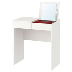 a white dressing table with a mirror and drawer on it's side, in front of a white background