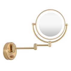 a gold wall mounted magnifying mirror with an adjustable arm and two lights on each side