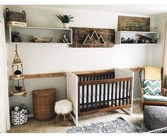 a baby's room is decorated in white and wood