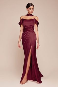 The fitted Emerson Gown features a stunning sweetheart off-the-shoulder design with a gathered hipline and an elegant leg slit, crafted from luxe satin. The structured boned bodice provides excellent support, while the lace-up corset back can drape around the neck for a unique twist. Perfect for bridesmaids, wedding guests, or formal events, this dress combines sophistication and allure effortlessly. Make a statement at your next occasion with this exquisite gown! Fitted Luxe Satin Gown Sweethea Red Wedding Dress Guest, Gown Fitted, Fitted Gown, Cinderella Divine, Lace Up Corset, Sheath Gown, Boned Bodice, Satin Evening Dresses, Timeless Dress