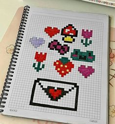 a notebook with some pixel art on it