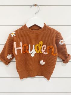 If you were looking for a custom name embroider sweater look no more! These sweaters are handmade by me with love. They are perfect for baby announcements, birthdays, or even every day! Sweaters are 100% Cotten. Each embroidery is done by hand so each sweater will vary. That's what makes them so special.  If you are looking for a color sweater that is not available please message me and I can help you find the color you are looking for!  Yarn: I can get any color yarn you would like for the name Customizable Cute Crew Neck Sweater, Cute Customizable Crew Neck Sweater, Cute Crew Neck Sweater With Custom Embroidery, Cute Sweater With Letter Embroidery For Fall, Personalized Cute Crew Neck Sweater, Cute Letter Embroidery Sweater For Fall, Cute Cotton Sweater For Birthday, Handmade Cotton Crew Neck Sweater, Embroider Sweater