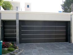 a large garage door is shown in front of a house