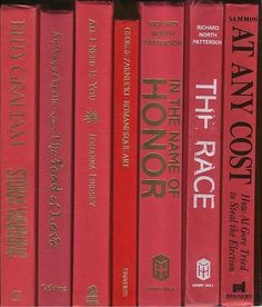 a row of red books sitting on top of each other